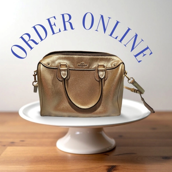 Coach Gold Satchel with Structured Design and Versatile...